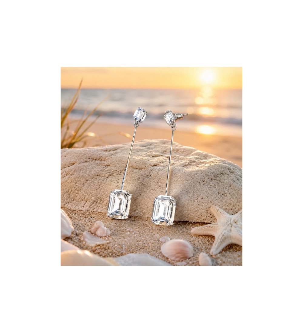 Description complète  Inspirées par la lumière dorée des couchers de soleil sur la côte landaise, les boucles d’oreilles Éléganc